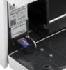 Hotpoint RGBS200DMWW gas range close-up showing cordless battery ignition compartment with installed battery.