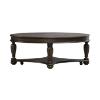 Hampton oval cocktail table side view with lower shelf and turned legs