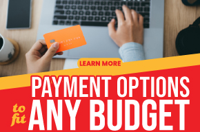 Person using a laptop while holding a credit card with bold text reading 