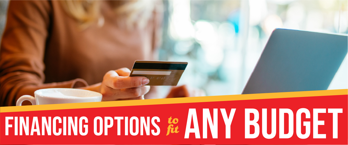 Person holding a credit card while using a laptop at a café, with text overlay reading “Financing options to fit any budget.”