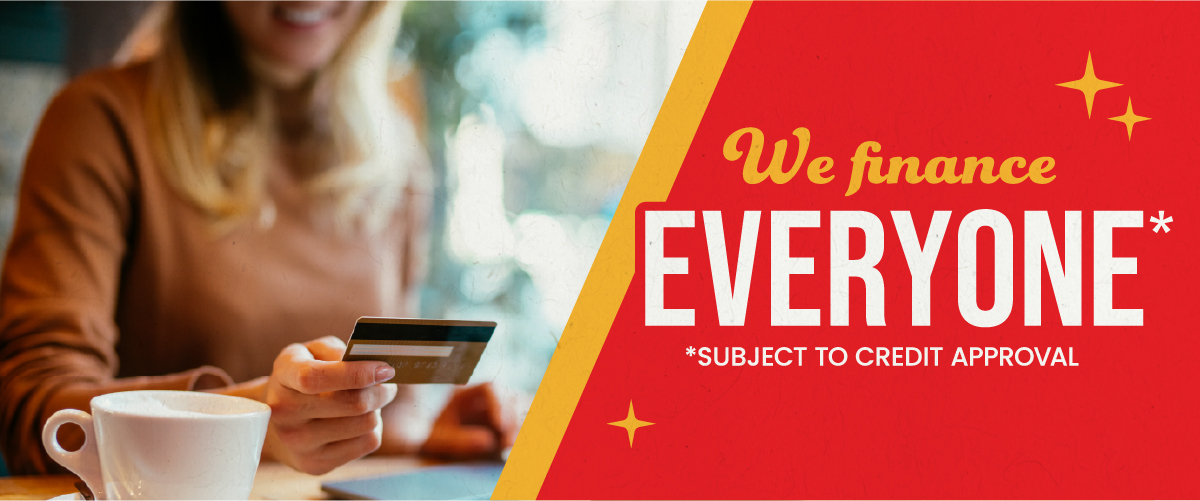 ABC Warehouse financing promotion showing a person holding a credit card next to text that reads “We finance EVERYONE*” with “*Subject to credit approval.”