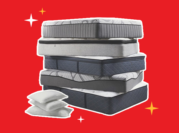 Stack of assorted mattresses with pillows in front, featuring different styles and thicknesses on a clean background with decorative accents.